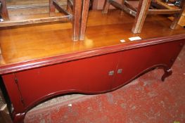 A red lacquered low side cupboard 160cm wide