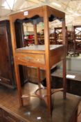 A George III mahogany two-tier washstand table 81cm high, 33cm wide