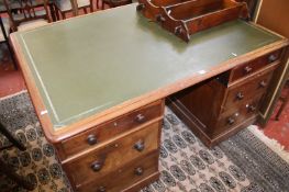 A Victorian mahogany partners desk with seven drawers and six to the reverse side 150cm wide