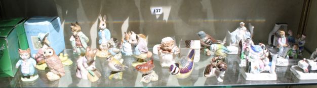 Six porcelain fairings, a Royal Crown Derby paperweight modelled as a wren, a Royal Doulton Beswick