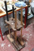 An Ayres wooden croquet stand with four mixed mallets