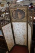 A gilt decorated three fold screen inset with a print 145cm wide