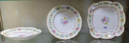 A late 19th Century Royal Worcester ivory ground dessert plate, decorated with floral sprays and