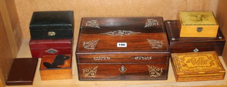A mahogany inlaid travelling box, a leather covered writing/stationary box, together with a further
