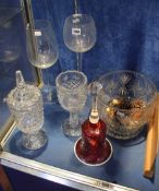 A large cranberry glass bell; 36cm high, two oversized wine glasses, a commemorative R.N.L.I. glass