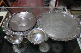 A London silver hallmarked three footed bowl; 6cm high, together with three plated trays/dishes and