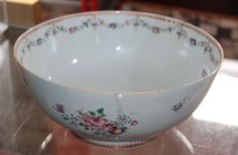 An 18th Century Chinese Export porcelain punch bowl, with monogram; 26cm diameter, extensively