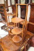 Two oak folding cake stands, a metamorphic walnut two tier trolley and a pair of Edwardian chairs