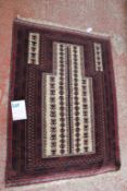 A Persian Balouchi prayer rug 137 x 104cm, together with two further Afghan rugs (3) Best Bid