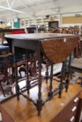 An oak gateleg table and two child`s chairs