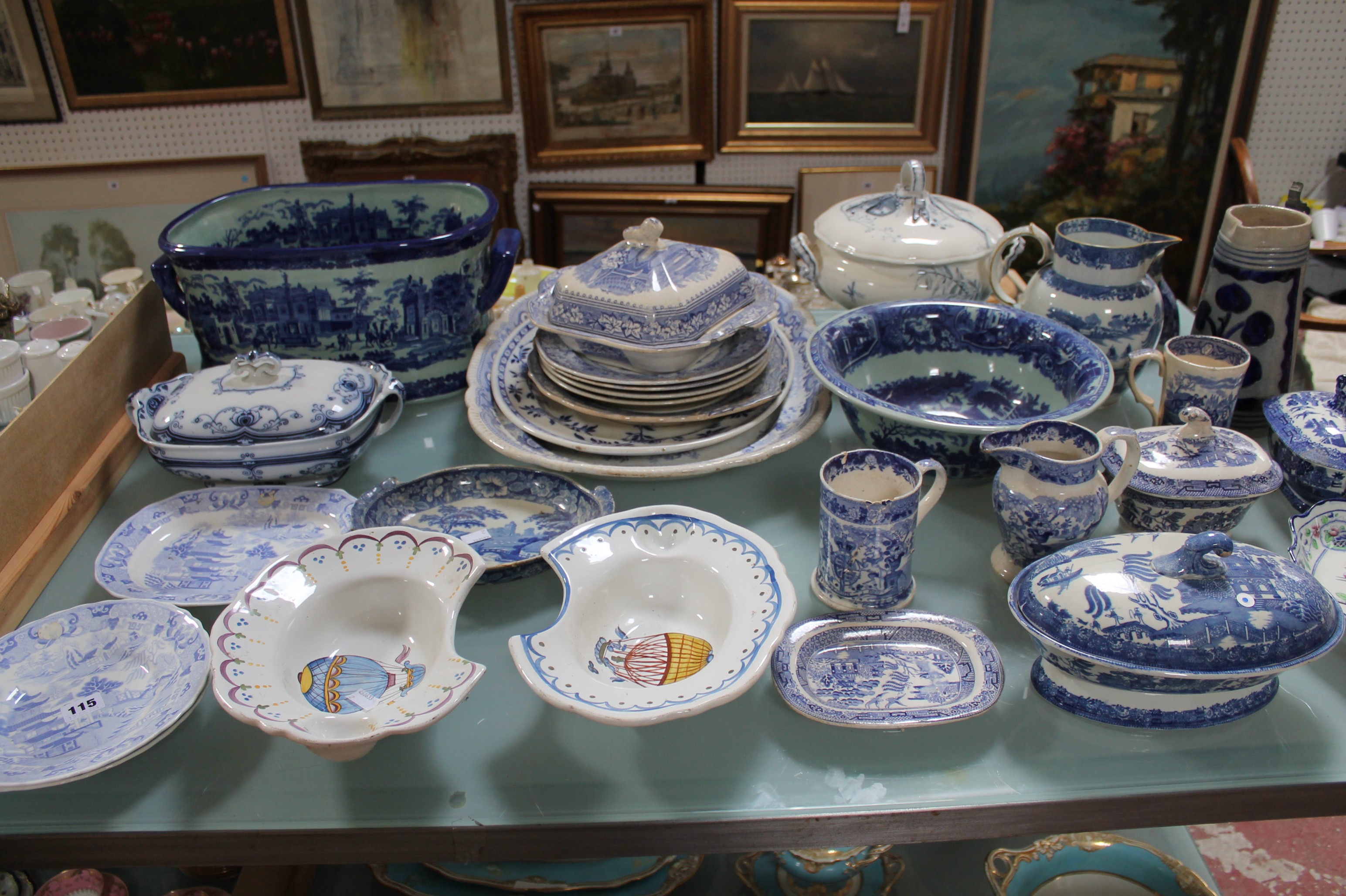 A large group of predominately blue and white pottery including a modern blue and white footbath,