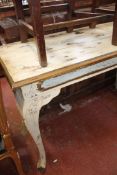 A distressed cream painted console table 77cm high, 120cm wide