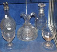 A triple ring necked glass decanter, a cut glass ships jug, a further compartmentalised glass