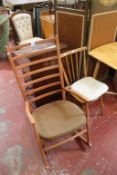 An Ercol side table, a rocking chair and a spindle chair.