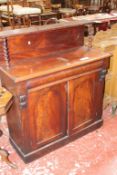 A Victorian mahogany chiffonier, the back with recessed rounded oblong panel beneath shelf