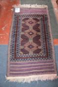 A Baluchi blue ground rug 153 x 76cm and another similar (2) Best Bid