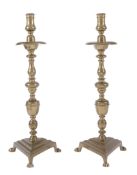 A pair of Continental brass candlesticks, late 17th century  A pair of Continental brass
