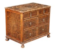 A William and Mary olive oyster veneered and holly crossbanded chest of...  A William and Mary