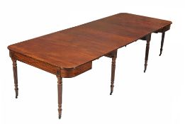 A Regency mahogany extending dining table, circa 1815  A Regency mahogany extending dining table,