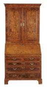 A George II burr walnut bureau bookcase, circa 1740  A George II burr walnut bureau bookcase  ,