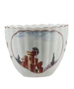 A Chelsea fluted tea bowl, circa 1753, painted with panels of ruins in...  A Chelsea fluted tea