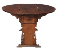 A Tuscan walnut drop leaf dining table, late 16th/early 17th century the...  A Tuscan walnut drop