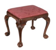 A George II walnut stool circa 1740 with a red damask drop in seat on shell...  A George II walnut