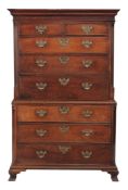 A George III walnut secretaire chest on chest circa 1790 the moulded cornice...  A George III