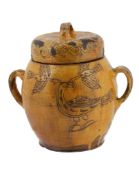 An incised slipware two-handled jar and cover, early 19th century  An incised slipware two-handled