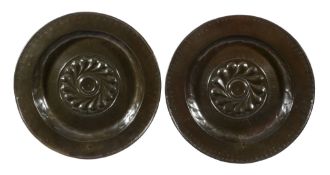 A matched pair of Nuremberg brass alms dishes, 16th century  A matched pair of Nuremberg brass alms
