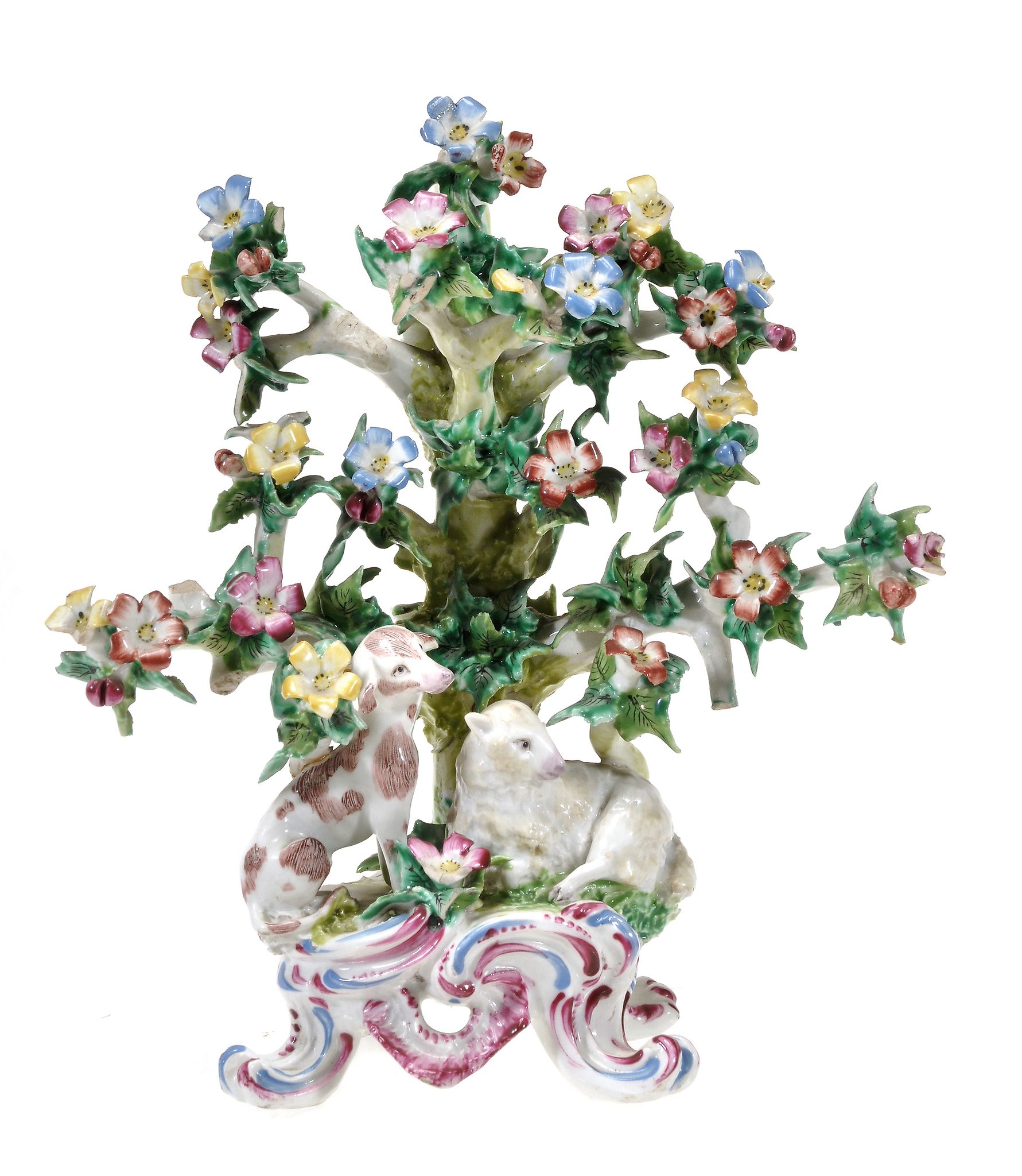 A Bow porcelain bocage group with `dismal` hound and lamb, circa 1765  A Bow porcelain bocage group
