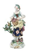 A Bow porcelain figure of a woman with birdcage emblematic of Matrimony  A Bow porcelain figure of