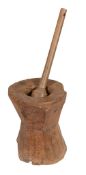 An oak mortar, 17th century, of facetted and inverted form  An oak mortar,   17th century, of