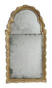 A George I giltwood wall mirror, circa 1720, the arched plate in two sections  A George I giltwood