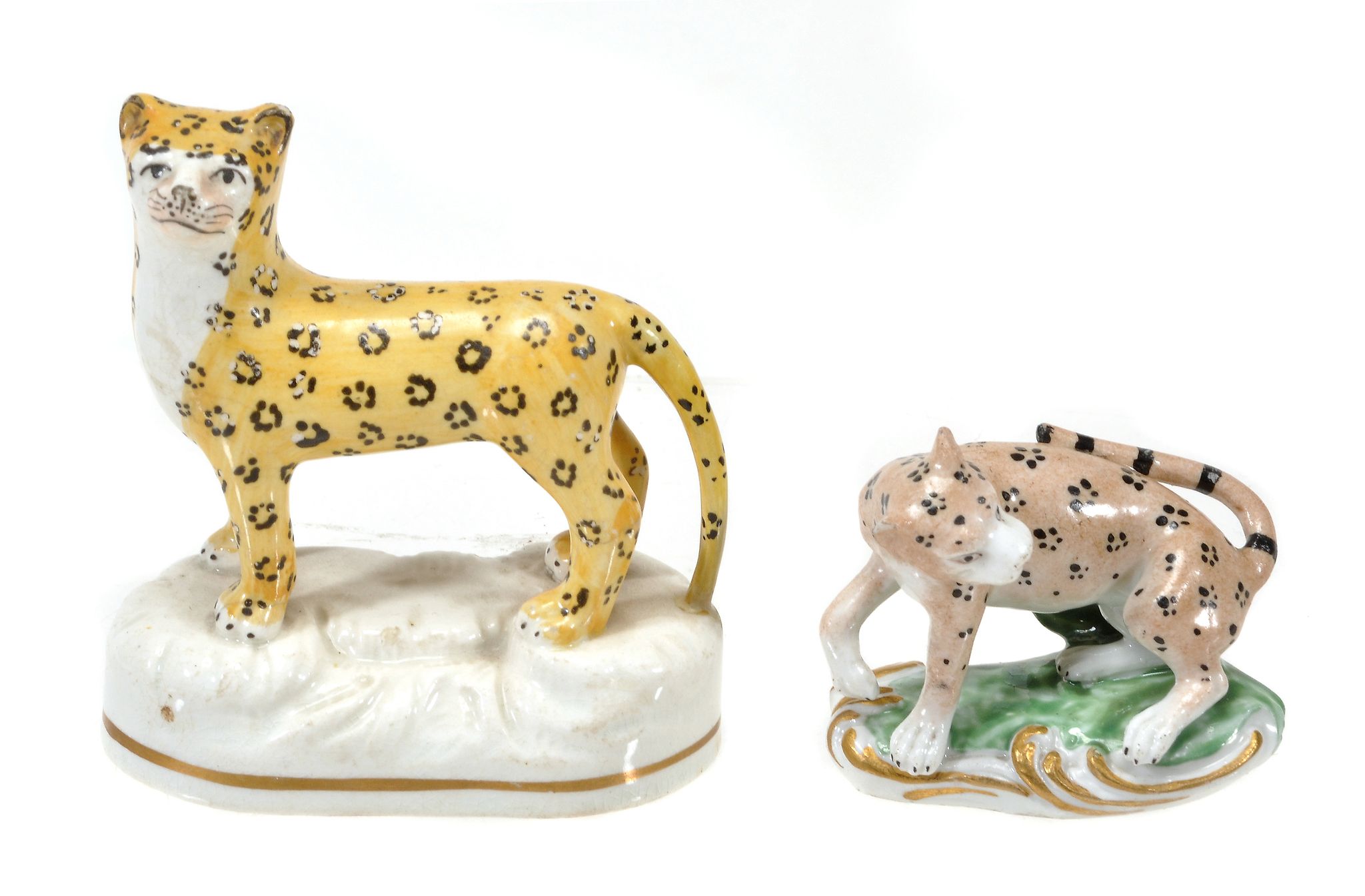 A Derby model of a leopard, circa 1825, 6cm in length; and a Staffordshire...  A Derby model of a