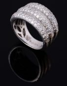A diamond set dress ring, the reeded broad band set with brilliant cut diamonds  A diamond set dress