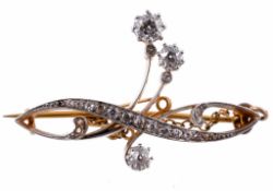 A diamond brooch, the scrolled design set with old brilliant cut diamonds  A diamond brooch,   the