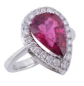 A tourmaline and diamond ring, the pear shaped pink tourmaline claw set...  A tourmaline and diamond