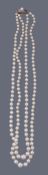 A two row cultured pearl necklace by Mikimoto  A two row cultured pearl necklace by Mikimoto  ,