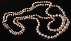 A cultured pearl necklace with diamond set clasp  A cultured pearl necklace with diamond set
