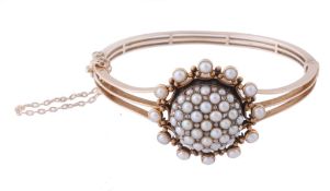 A Victorian half pearl and rose cut diamond hinged bangle , circa 1880  A Victorian half pearl and