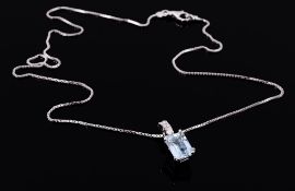 An aquamarine and diamond pendant, the rectangular shaped aquamarine in a...  An aquamarine and