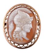 A shell cameo brooch, the oval panel carved with the profile of Mercury...  A shell cameo