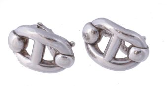 A pair of silver Chaine d`ancre ear clips by Hermes, the polished oval ear clip  A pair of silver