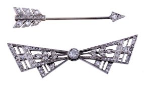 A diamond bow brooch, the pierced geometric bow with foliate detail  A diamond bow brooch,   the