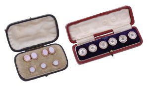 A set of six buttons, the circular mother of pearl panels within an enamel...  A set of six buttons,
