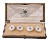 A pair of mother of pearl and ruby cufflinks  A pair of mother of pearl and ruby cufflinks,   the