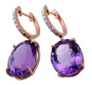 A pair of amethyst and diamond ear pendents  A pair of amethyst and diamond ear pendents,   the oval