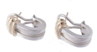 A pair of earrings by Tiffany & Co., the two colour hoops with brushed detail  A pair of earrings by