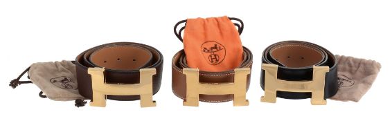 Hermes, three leather gold colour H buckle belts, two in Togo leather, one tan  Hermes, three